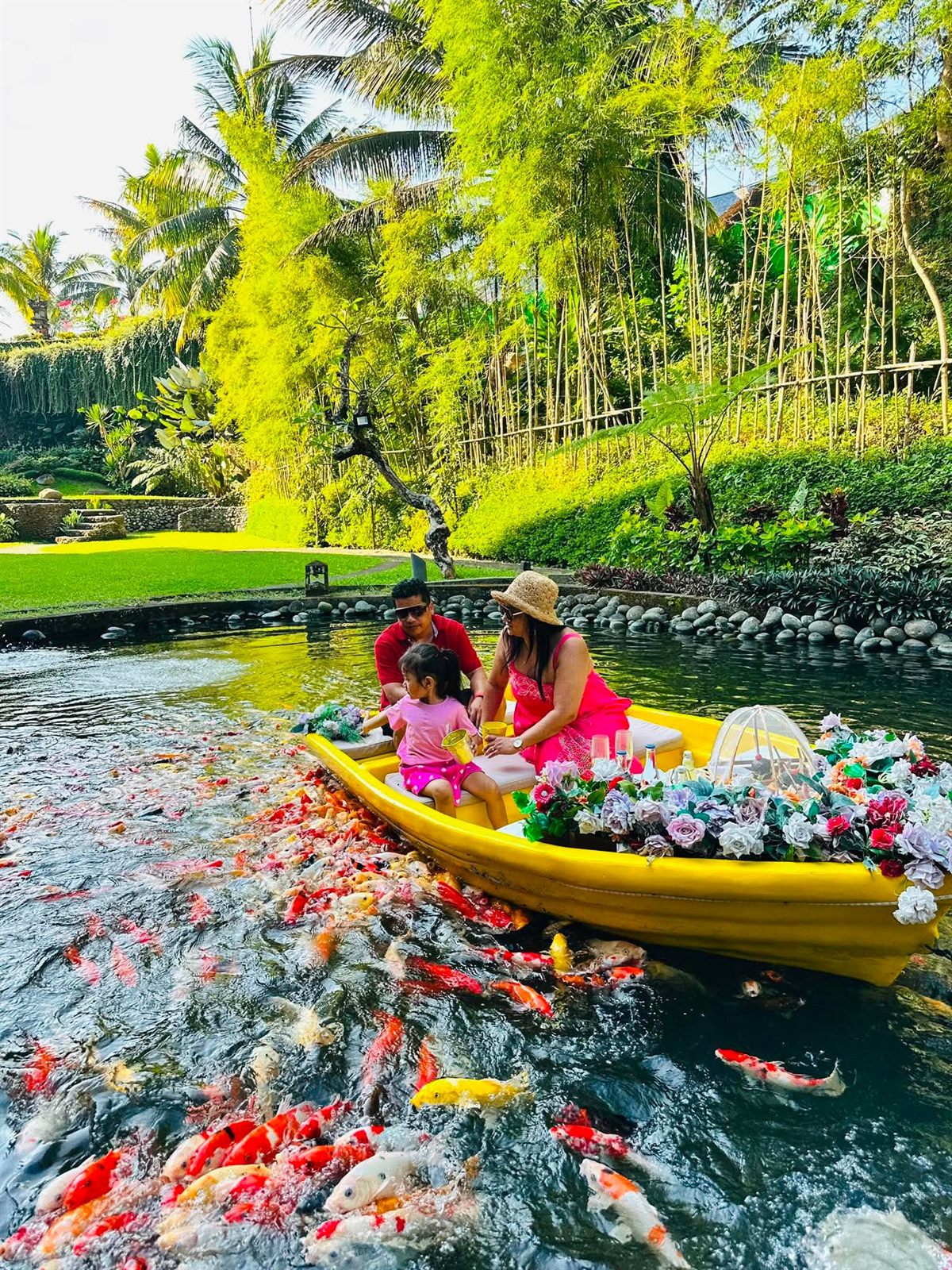 Travellers at a koi pond in Bali